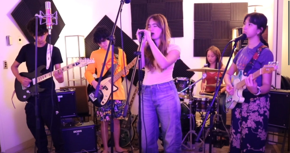 youth band performing live during music rehearsal indoors